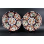 PAIR OF JAPANESE IMARI CHARGERS, 19th century, a kakiemon style centre inside six panels with