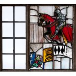 ARTS & CRAFTS STAIN GLASS PANEL a large pictorial stain glass panel of a Medieval Knight on