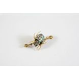 AN EARLY 20TH CENTURY OPAL AND DIAMOND SPIDER BROOCH the body set with circular solid white opals