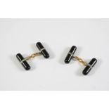 A PAIR OF BLACK ONYX AND DIAMOND CUFFLINKS each black onyx baton is mounted with a circle of rose-