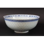 CHINESE BLUE AND WHITE RICE PATTERN BOWL, 19th century, a central stork and flowers inside a