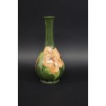 MOORCROFT VASE - HIBISCUS a large Moorcroft vase in the Hibiscus design on a green ground, with