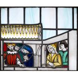 ARTS & CRAFTS STAIN GLASS PANEL a pictorial stain glass panel with depictions of Medieval figures,