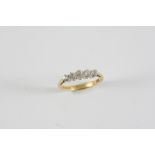 A DIAMOND FIVE STONE RING the five graduated old cut diamonds are set in 18ct gold. Size K