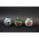 MOORCROFT GINGER JARS 3 small lidded ginger jars, in the Spring Flowers, Anemone, and Hibiscus