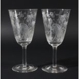 PAIR OF GOBLETS, possibly Stourbridge, the rounded funnel bowls engraved with a crane standing in