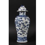 CHINESE BLUE AND WHITE VASE AND COVER, Kangxi style, painted with dragons amongst clouds beneath