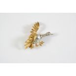 A DIAMOND, PEARL AND GOLD BIRD BROOCH depicting a bird taking flight, the baroque pearl body is