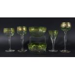 PART SUITE OF MOSER STYLE DRINKING GLASSES, the bowls in green shading to clear with gilt fruiting