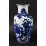 CHINESE BLUE AND WHITE VASE, of baluster form, painted with men carrying a toad, ruyi sceptres and a