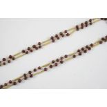 A GOLD AND TOURMALINE NECKLACE the gold necklace is mounted with purple tourmaline beads, 84cm long