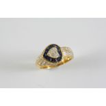 A SAPPHIRE AND DIAMOND CLUSTER RING BY ADLER the heart-shaped diamond is set within a heart-shaped