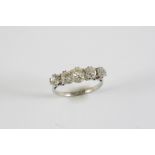 AN EARLY 20TH CENTURY DIAMOND FIVE STONE RING the five graduated old cushion-shaped diamonds are set