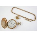 A 9CT GOLD FULL HUNTING CASED POCKET WATCH BY A.W.W.Co, WALTHAM MASS the signed white enamel dial