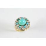 A TURQUOISE AND DIAMOND CLUSTER RING the central turquoise stone is set within a surround of