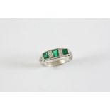 AN EMERALD AND DIAMOND RING the three rectangular-shaped emeralds are set with four circular-cut