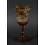 BOHEMIAN AMBER GLASS GOBLET, cut through to clear with a stag in woodland, height 18.5cm