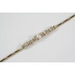 A DIAMOND, PEARL AND GOLD BRACELET the foliate design is set with old circular-cut and rose-cut