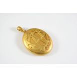 A VICTORIAN GOLD DOUBLE SIDED LOCKET PENDANT embossed to one side with initials, 5.5 X 4cm, 47