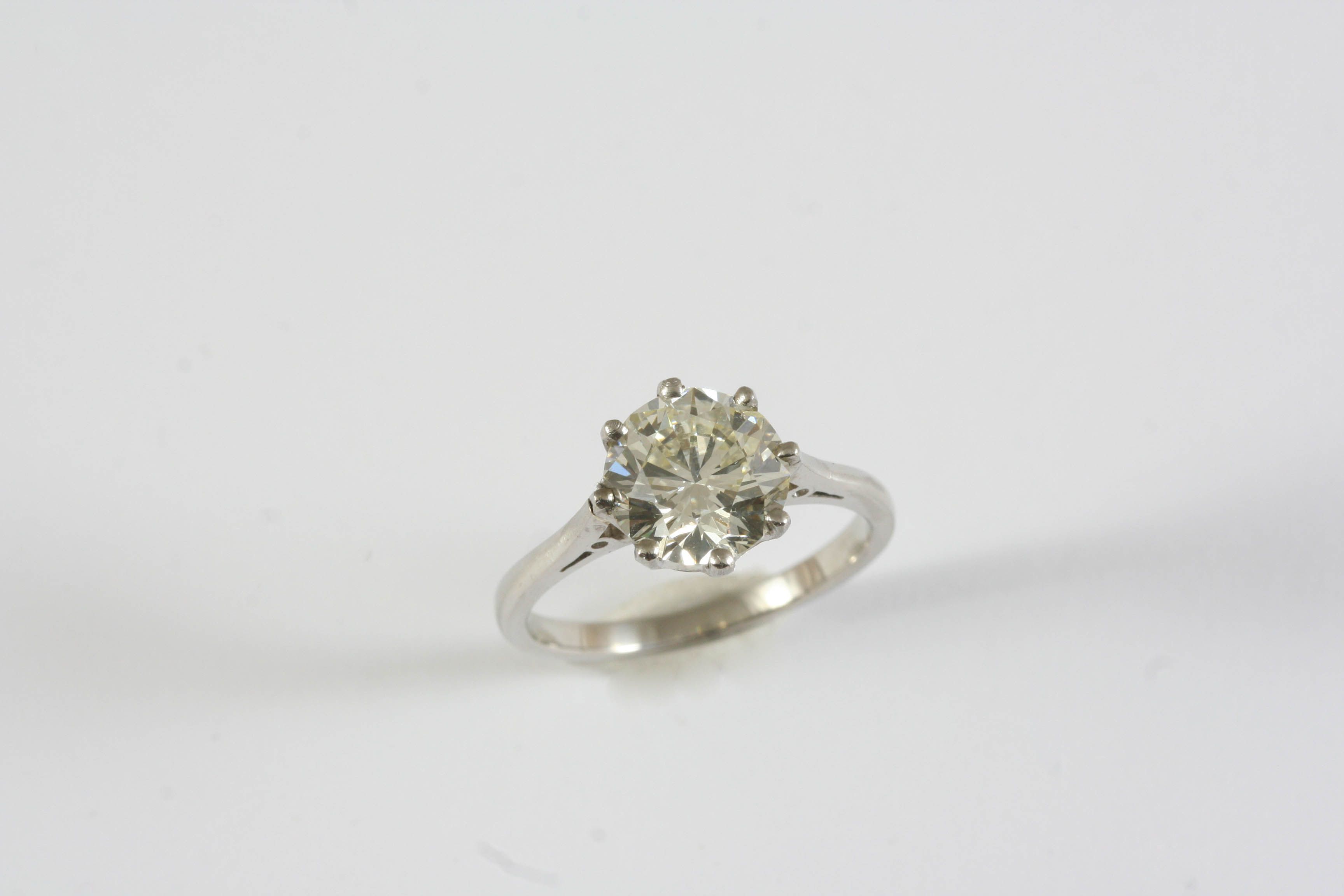 A DIAMOND SOLITAIRE RING the brilliant-cut diamond weighs 2.16 carats and is set in platinum. Size L
