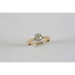 A DIAMOND SOLITAIRE RING the brilliant-cut diamond weighs approximately 0.65 carats and is set in