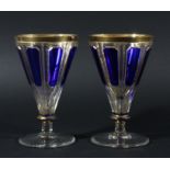 PAIR OF BOHEMIAN BLUE PANEL GOBLETS, probably Moser, the conical body with blue panels on clear