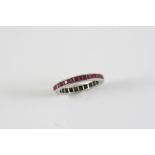 A RUBY FULL CIRCLE ETERNITY RING set with calibre-cut rubies in engraved mount. Size M