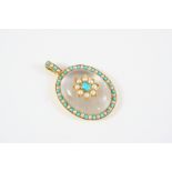 A TURQUOISE AND PEARL SET PENDANT the central flowerhead motif is set with an oval turquoise