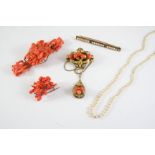 A QUANTITY OF JEWELLERY including an openwork and carved coral bracelet, a carved coral brooch, of