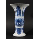 CHINESE BLUE AND WHITE GU VASE, Kangxi style but later, painted with dragon masks on a key ground