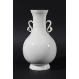 CHINESE VASE, probably Daoguang, of baluster form with ruyi handles, in the white, height 20cm