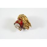AN 18CT GOLD, DIAMOND AND ENAMEL BROOCH BY KUTCHINSKY designed as a roaring lion, mounted with