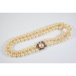 A DOUBLE ROW UNIFORM CULTURED PEARL CHOKER NECKLACE the pearls measure approximately 8.9mm and are