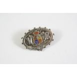 A SILVER AND ENAMEL BROOCH celebrating the Golden Jubilee of Queen Victoria in 1887, 4cm wide