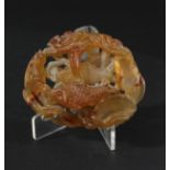 CHINESE JADE HARDSTONE CARVING, of fish swimming amongst lotus stems and flowers, length 10cm