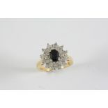 A SAPPHIRE AND DIAMOND CLUSTER RING the oval-shaped sapphire is set within a surround of circular-