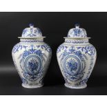 PAIR OF FAIENCE JARS AND COVERS, 19th century and probably French, of ovoid form blue painted with