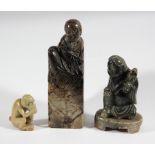 CHINESE MOTTLED JADE SEAL, carved as a scholar seated on a rock, height 11cm; together with two