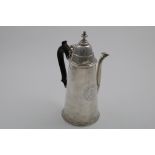 A QUEEN ANNE CHOCOLATE POT of tapering cylindrical form with a domed cover and removable finial,