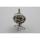 A GEORGE III SMALL GLOBE INKSTAND on four legs with a fitted interior and acorn finial, by John