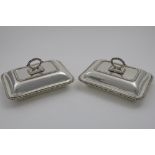 A PAIR OF EARLY 20TH CENTURY ENTREE DISHES & COVERS rectangular, cushion form with gadrooned borders