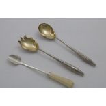 A PAIR OF ARTS & CRAFTS SALAD SERVERS with ribbed, swollen handles & gilt bowls, by Mappin & Webb,