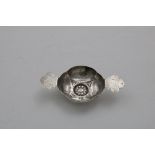 AN EARLY 18TH CENTURY NORWEGIAN SMALL TASTING CUP of lobed circular outline with a flower head
