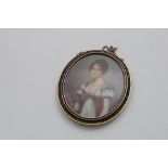 AN EARLY 19TH CENTURY PORTRAIT MINIATURE of a young lady wearing a blue-trimmed white dress and