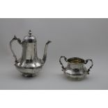 A VICTORIAN COFFEE POT AND MATCHING SUGAR BOWL with lobed, baluster bodies, decorated with engraving
