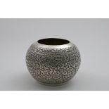 AN INDIAN EMBOSSED BOWL of near spherical form, probably late 20th century; 5.6" (14.2 cms) high;