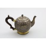 A LATE 18TH CENTURY RUSSIAN SILVERGILT & NIELLOWORK TEA POT bullet-shaped, with a lift-off, domed