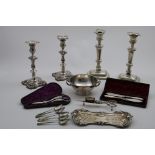 PLATED WARE:- Two pairs of Old Sheffield plated candlesticks and five tea spoons, a pair of