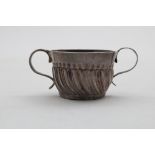 A WILLIAM III MINIATURE OR TOY PORRINGER with a swirl-fluted lower body and reeded, S-scroll