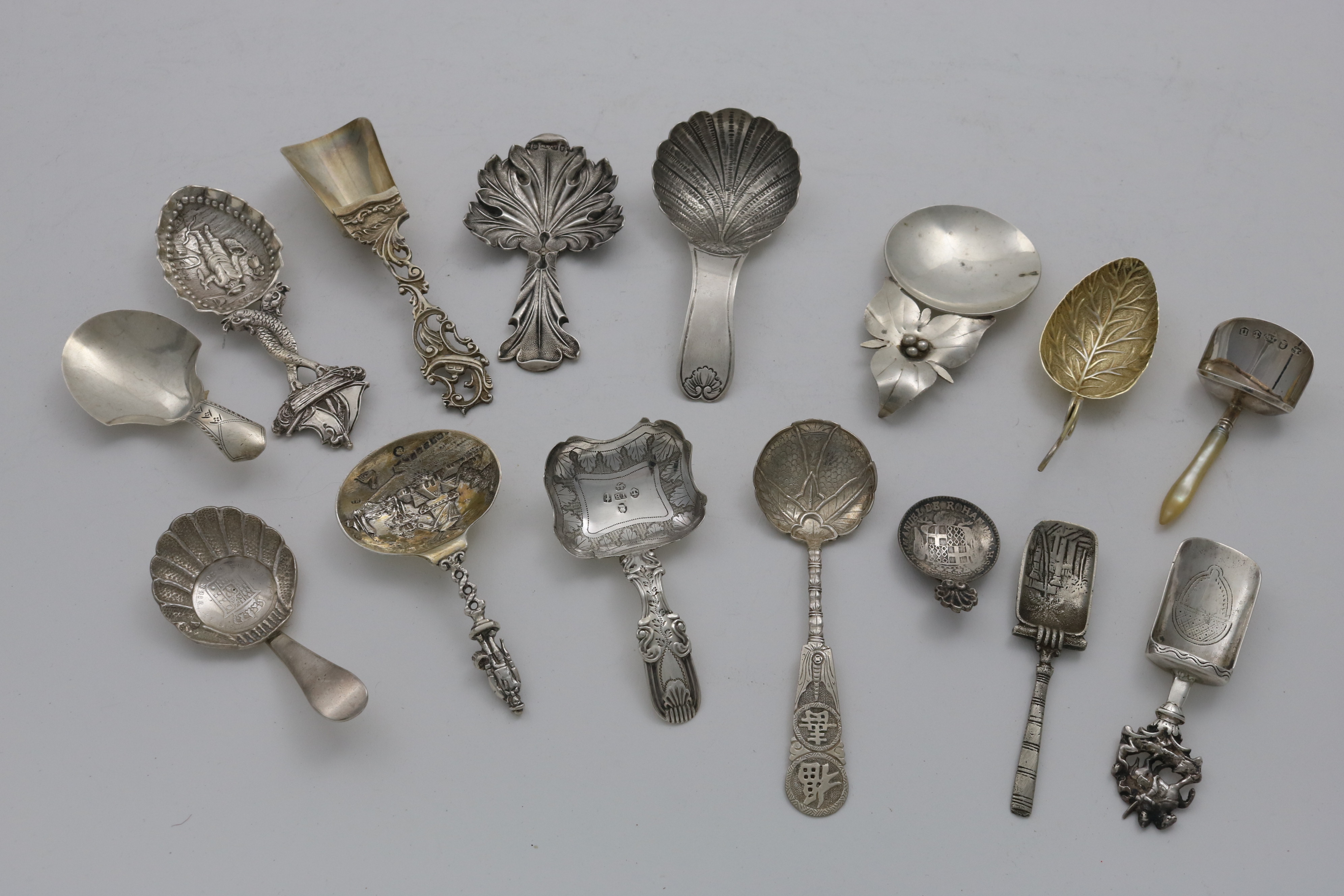 TEN VARIOUS FOREIGN CADDY SPOONS and five various antique, Birmingham-hallmarked caddy spoons; the